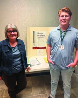 Assistant Professor Doris Feltham standing with VITA student